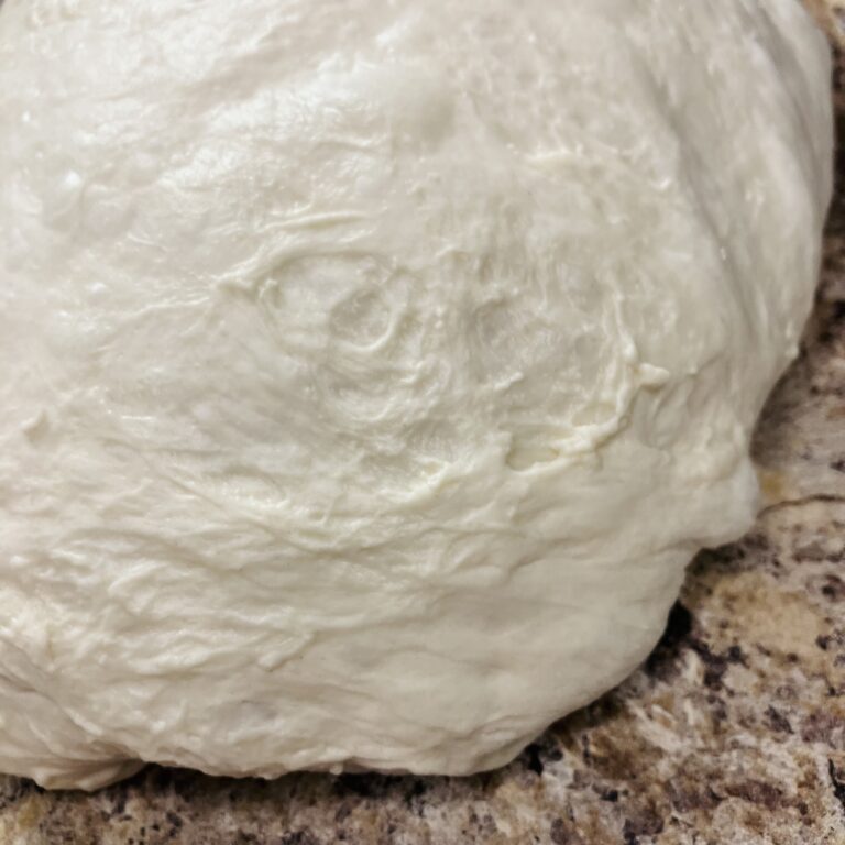 bread dough that needs more development, tearing